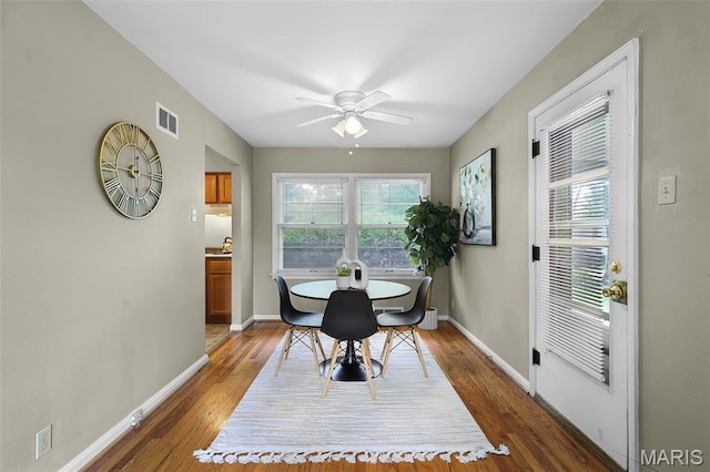 450 Forest Green Dr, Webster Groves, MO 63119 - dining area featuring ceiling fan, healthy amount of natural light, and wood finished floors