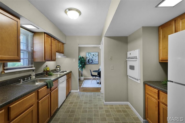 450 Forest Green Dr, Webster Groves, MO 63119 - kitchen featuring white appliances, dark countertops, tile patterned floors, under cabinet range hood, and brown cabinets