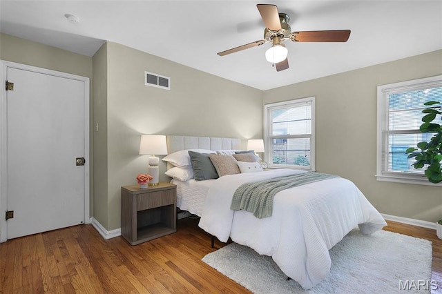 450 Forest Green Dr, Webster Groves, MO 63119 - bedroom with wood finished floors and a ceiling fan