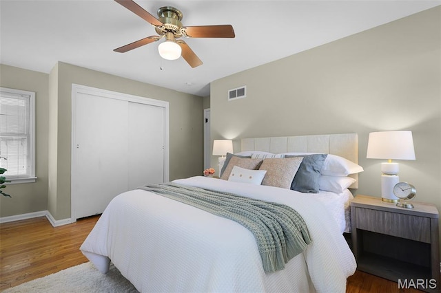 450 Forest Green Dr, Webster Groves, MO 63119 - bedroom featuring wood finished floors, a closet, and a ceiling fan