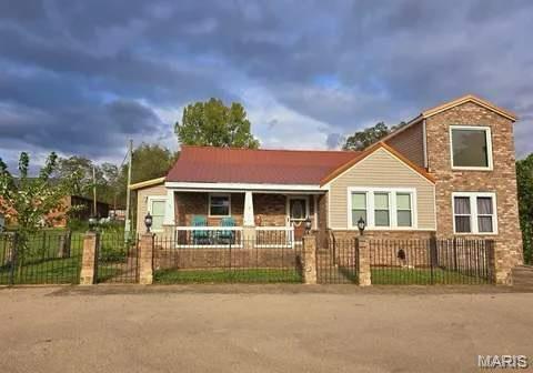 115 Whitener St, Marquand, MO 63655 - bungalow with covered porch, a fenced front yard, and a gate