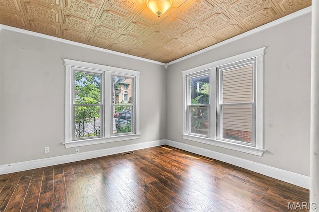 325 N Lorimier St, Cape Girardeau, MO 63701 - spare room featuring an ornate ceiling, crown molding, and dark wood-style floors