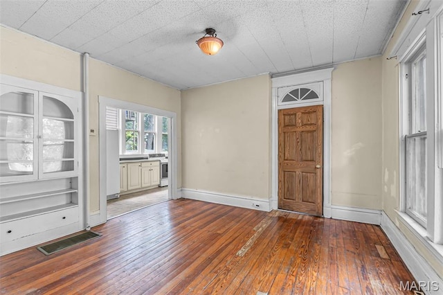 325 N Lorimier St, Cape Girardeau, MO 63701 - spare room featuring hardwood / wood-style flooring and baseboards