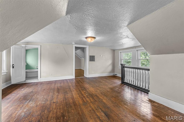 325 N Lorimier St, Cape Girardeau, MO 63701 - bonus room featuring a textured ceiling and wood-type flooring