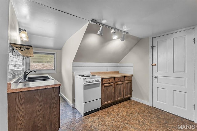 325 N Lorimier St, Cape Girardeau, MO 63701 - kitchen with white electric range oven, track lighting, vaulted ceiling, and light countertops