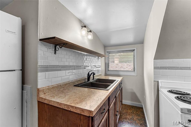 325 N Lorimier St, Cape Girardeau, MO 63701 - kitchen with freestanding refrigerator, open shelves, range, backsplash, and vaulted ceiling