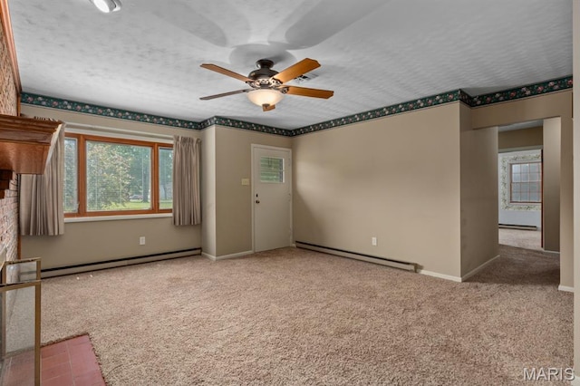 201 E Old Route 66, Mount Olive, IL 62069 - carpeted spare room featuring a baseboard heating unit, ceiling fan, a baseboard radiator, and a textured ceiling