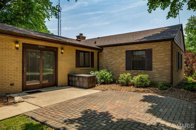 201 E Old Route 66, Mount Olive, IL 62069 - rear view of property featuring brick siding, a patio area, a chimney, and a shingled roof