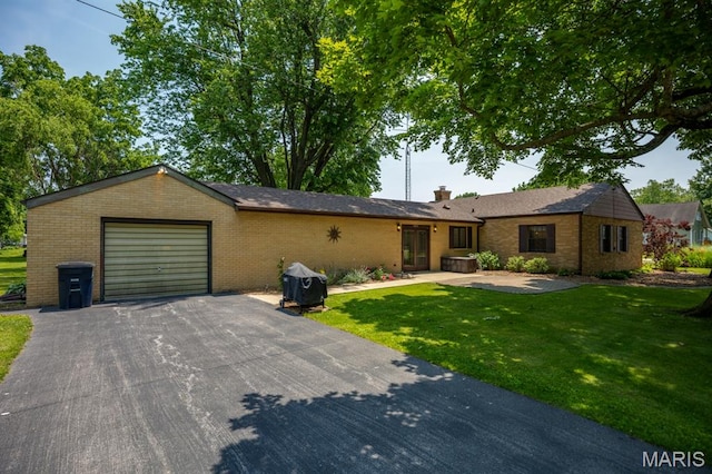 201 E Old Route 66, Mount Olive, IL 62069 - ranch-style house featuring an attached garage, brick siding, driveway, and a front lawn