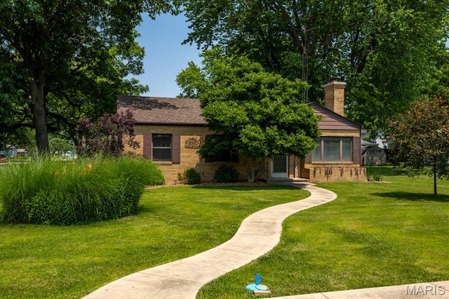 201 E Old Route 66, Mount Olive, IL 62069 - view of front of property featuring brick siding, a front lawn, and a chimney