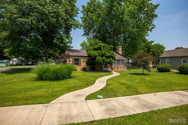 201 E Old Route 66, Mount Olive, IL 62069 - view of property hidden behind natural elements featuring a front lawn, a chimney, and brick siding