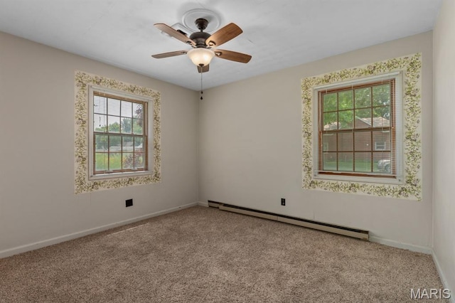 201 E Old Route 66, Mount Olive, IL 62069 - empty room with a baseboard heating unit, carpet floors, and ceiling fan