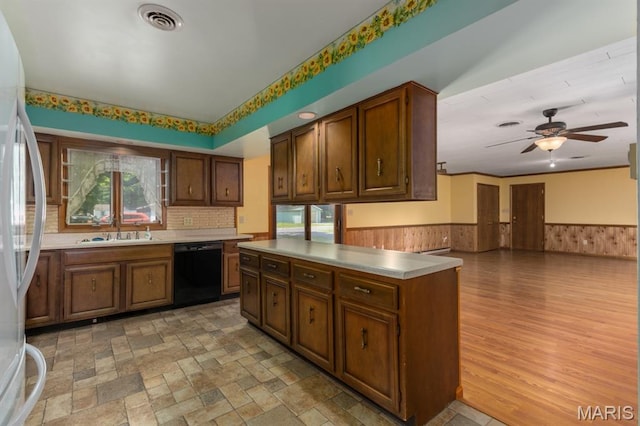201 E Old Route 66, Mount Olive, IL 62069 - kitchen with dishwasher, freestanding refrigerator, a wainscoted wall, ceiling fan, and light countertops