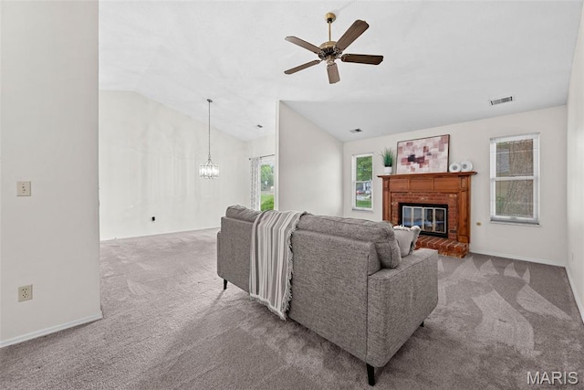 334 Devonshire Ct Unit A, Saint Peters, MO 63376 - carpeted living area with vaulted ceiling, ceiling fan, a chandelier, and a fireplace