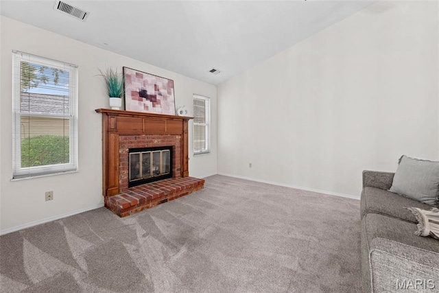 334 Devonshire Ct Unit A, Saint Peters, MO 63376 - living room featuring light carpet and a fireplace
