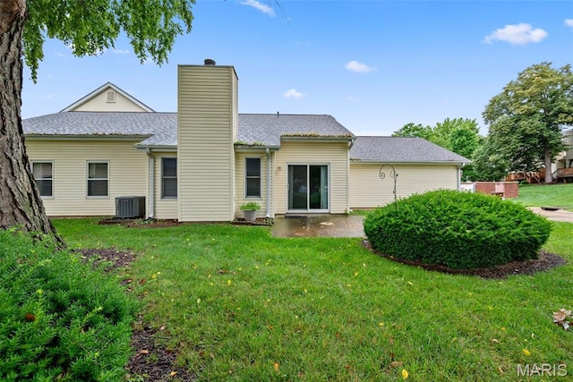 334 Devonshire Ct Unit A, Saint Peters, MO 63376 - rear view of property with a chimney, a lawn, and roof with shingles