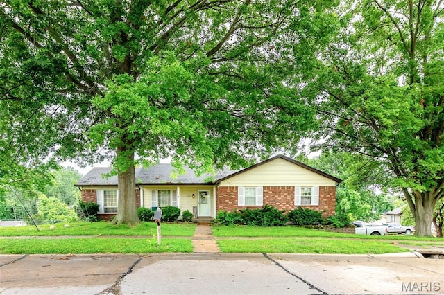 6048 La Chateau Ct, Saint Louis, MO 63129 - view of front of property featuring brick siding and a front lawn