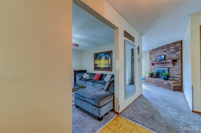 6048 La Chateau Ct, Saint Louis, MO 63129 - carpeted living room with a textured ceiling and a fireplace