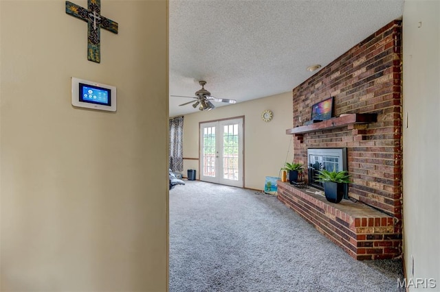 6048 La Chateau Ct, Saint Louis, MO 63129 - carpeted living room with a textured ceiling, a brick fireplace, and ceiling fan
