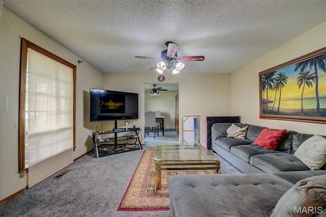 6048 La Chateau Ct, Saint Louis, MO 63129 - carpeted living area featuring ceiling fan and a textured ceiling