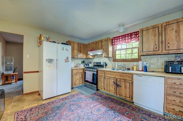 6048 La Chateau Ct, Saint Louis, MO 63129 - kitchen with white appliances, under cabinet range hood, light countertops, brown cabinets, and backsplash