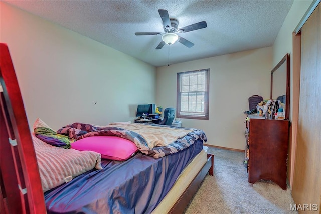 6048 La Chateau Ct, Saint Louis, MO 63129 - carpeted bedroom with a textured ceiling and ceiling fan