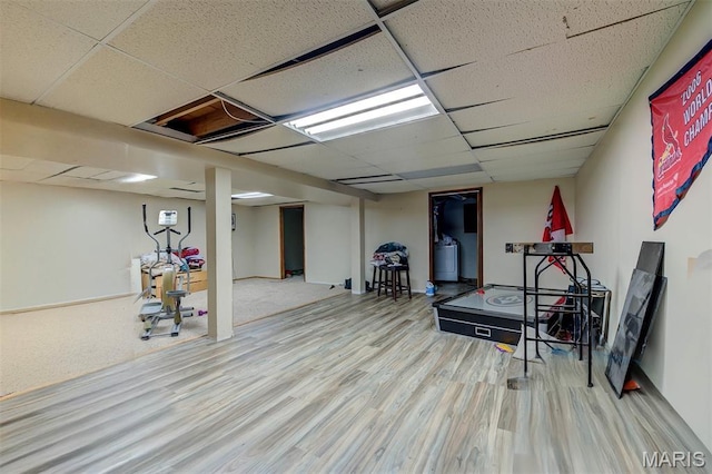 6048 La Chateau Ct, Saint Louis, MO 63129 - workout room featuring a drop ceiling and wood finished floors