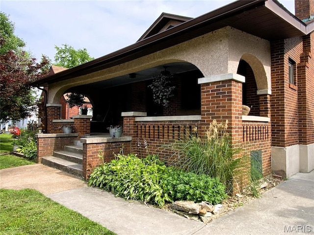 218 W 6th St, Hermann, MO 65041 - view of front of property with a porch, brick siding, and a chimney