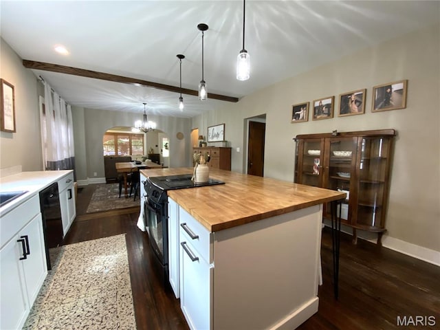 218 W 6th St, Hermann, MO 65041 - kitchen with black appliances, wooden counters, arched walkways, white cabinets, and dark wood finished floors