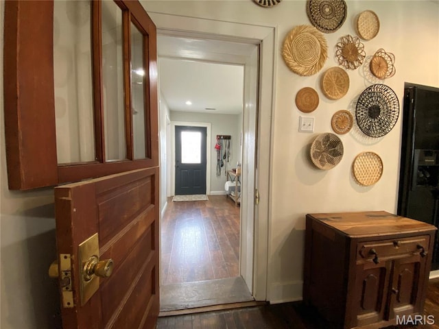 218 W 6th St, Hermann, MO 65041 - foyer featuring baseboards and dark wood-type flooring
