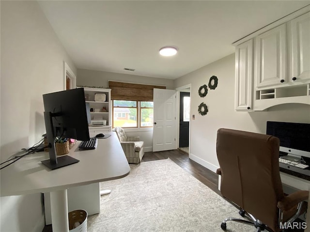 218 W 6th St, Hermann, MO 65041 - office area featuring dark wood finished floors and baseboards