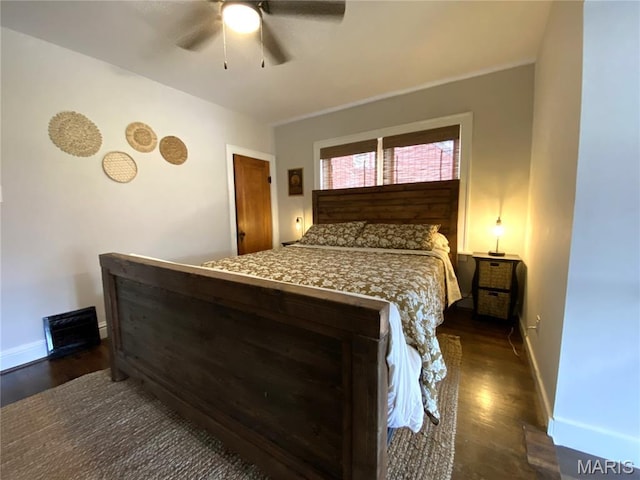 218 W 6th St, Hermann, MO 65041 - bedroom with dark wood-style floors and ceiling fan