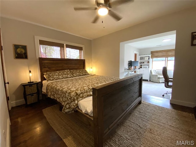 218 W 6th St, Hermann, MO 65041 - bedroom with a desk, dark wood-style floors, and a ceiling fan