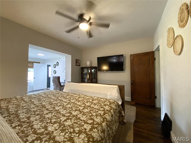 218 W 6th St, Hermann, MO 65041 - bedroom with dark wood-style floors and ceiling fan