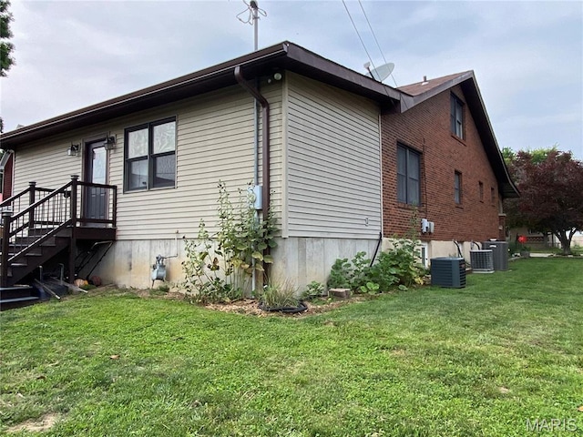 218 W 6th St, Hermann, MO 65041 - view of property exterior featuring a lawn and brick siding