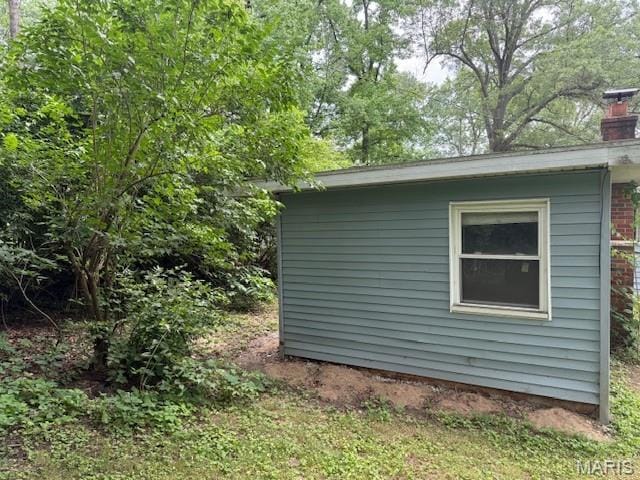 207 Hunter St, Lebanon, IL 62254 - view of side of property featuring a chimney