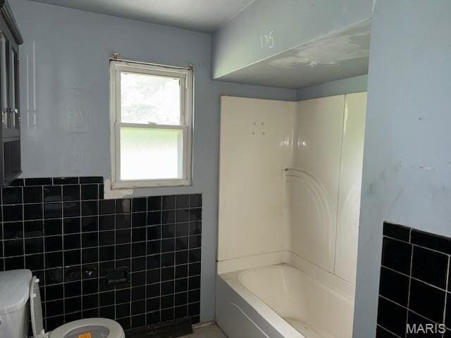 207 Hunter St, Lebanon, IL 62254 - bathroom with tile walls and shower / washtub combination