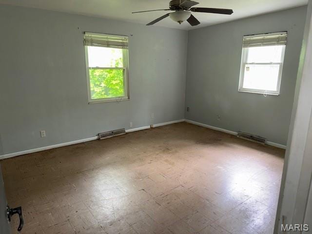 207 Hunter St, Lebanon, IL 62254 - empty room with plenty of natural light and a ceiling fan