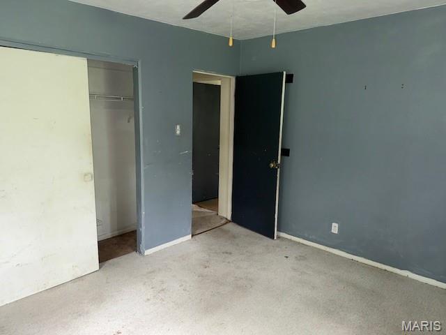 207 Hunter St, Lebanon, IL 62254 - unfurnished bedroom featuring a closet and a ceiling fan
