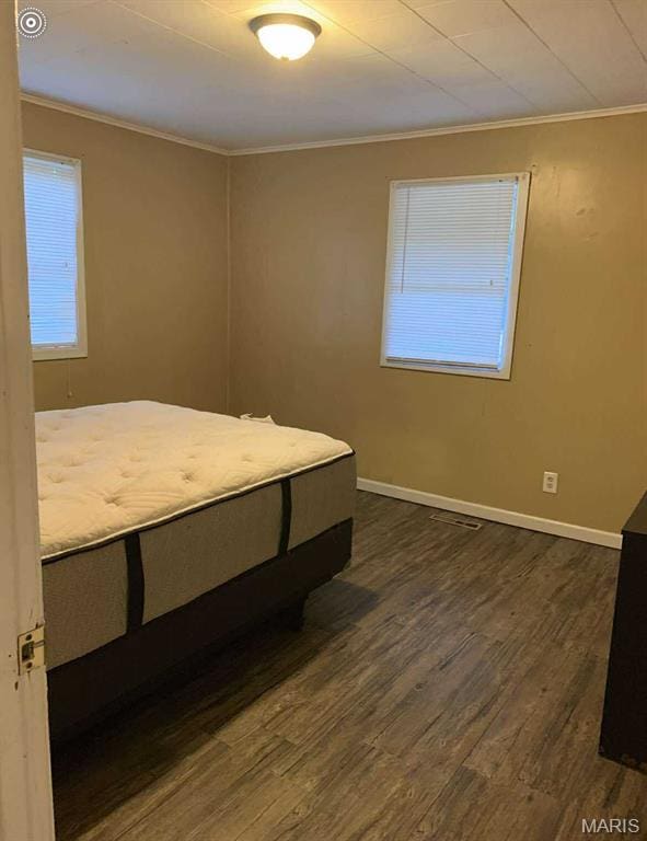 1005 Burford Ct, Doniphan, MO 63935 - bedroom featuring crown molding and dark wood-style flooring