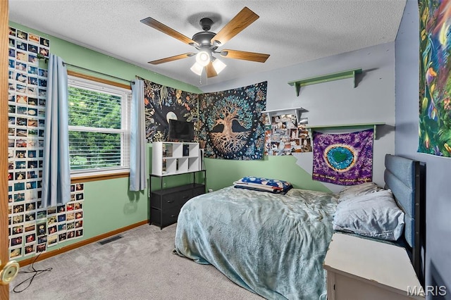 1802 Old Cape Rd, Jackson, MO 63755 - carpeted bedroom featuring a textured ceiling and ceiling fan