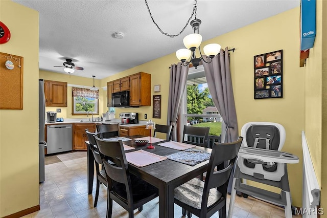 1802 Old Cape Rd, Jackson, MO 63755 - dining area with a ceiling fan and a textured ceiling