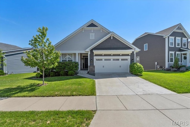 2333 Cabric Dr, Saint Charles, MO 63301 - view of front of home featuring a garage, a front lawn, and concrete driveway