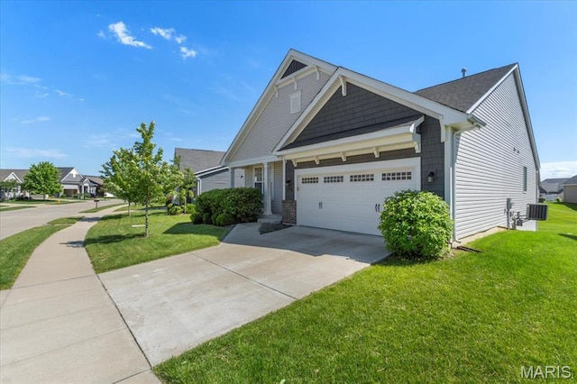2333 Cabric Dr, Saint Charles, MO 63301 - craftsman-style house with an attached garage, a front yard, and concrete driveway