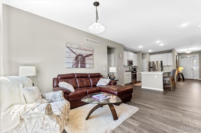 2333 Cabric Dr, Saint Charles, MO 63301 - living room featuring wood finished floors and recessed lighting
