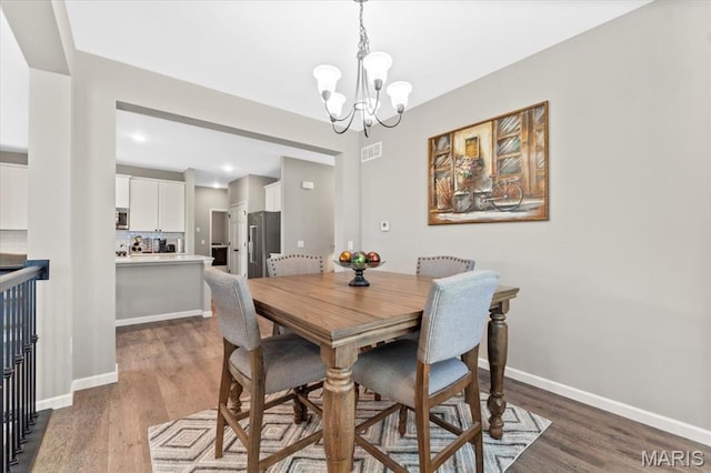 2333 Cabric Dr, Saint Charles, MO 63301 - dining space featuring a chandelier, dark wood-style floors, and recessed lighting