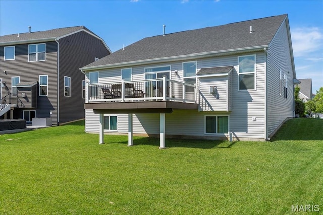 2333 Cabric Dr, Saint Charles, MO 63301 - back of property featuring a deck and a lawn