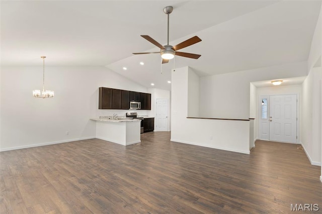 262 Liberty Valley Dr, Foristell, MO 63348 - unfurnished living room featuring vaulted ceiling, ceiling fan, a chandelier, dark wood-style floors, and recessed lighting