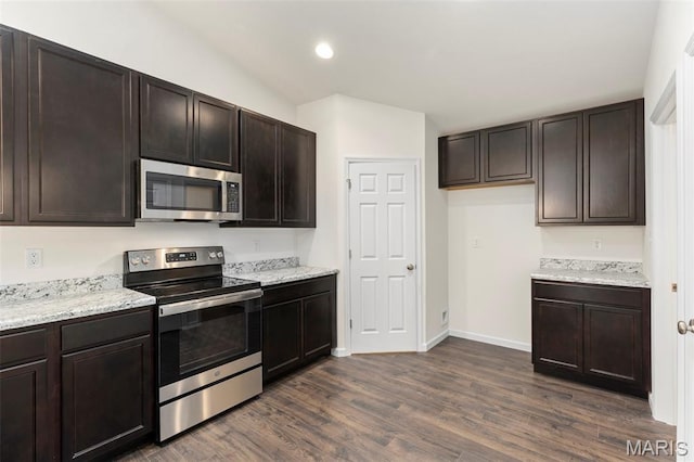 262 Liberty Valley Dr, Foristell, MO 63348 - kitchen featuring appliances with stainless steel finishes, dark wood-type flooring, dark brown cabinetry, recessed lighting, and vaulted ceiling