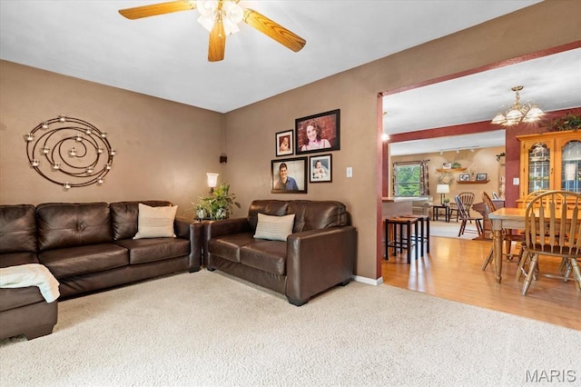 334 Hazel Ave, Belleville, IL 62223 - carpeted living area with a ceiling fan and a chandelier